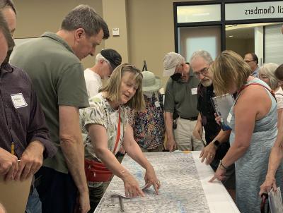 community members looking at project designs